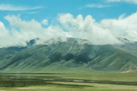 Snow mountains with clouds Stock Photos