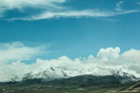 Snow mountains with clouds Stock Photos