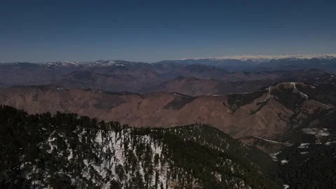 Snow mountains covered with vegetation trees. aerial drone shot of Himalayan  Stock Footage 158084422