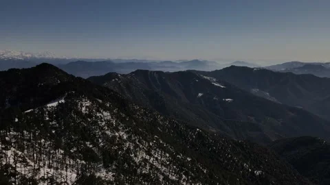 Snow mountains covered with vegetation trees. aerial drone shot of Himalayan  Video stock 158084491