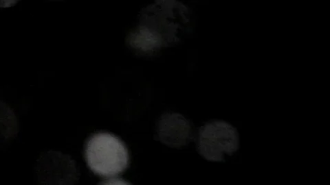 Snow at night through the window glass with drops. Flying from left bottom. Stock-Footage 71390618