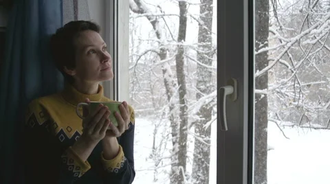 Snow Outside the Window and Hot Tea Stock Footage 44829730