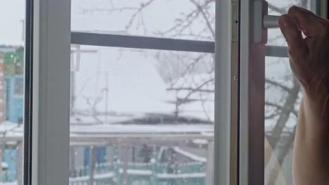 Snow outside the window Stock Footage 232488136