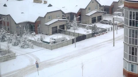 Snow over cottages and multi storey houses Stock Footage 81259767