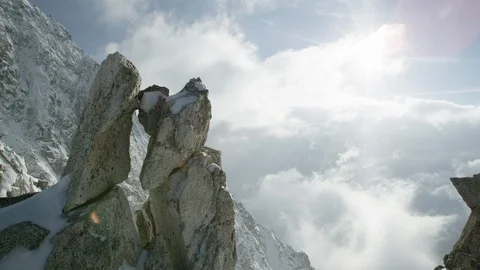 Snow over the sides of a remote mountain on a sunny day Stock Footage 113219768