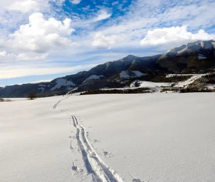 Snow path on mountain's slope Stock Photos