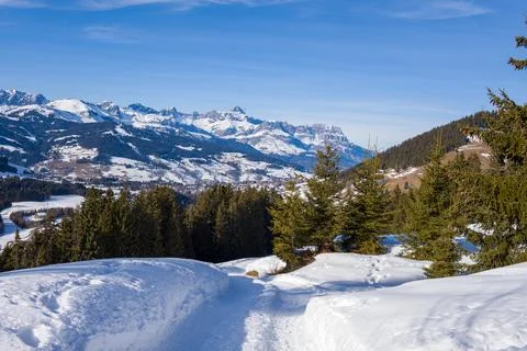 Snow path overlooking Aravis mountain panorama Stock Photos