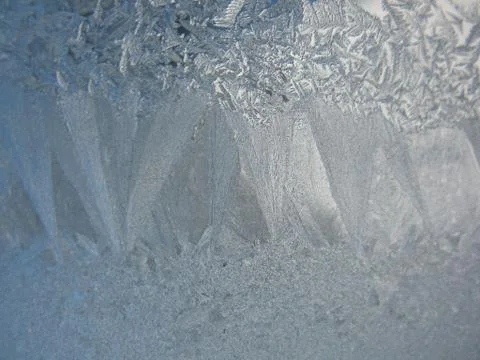 Snow pattern on winter window... Stock Photos