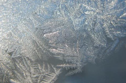 Snow pattern on winter window... Stock Photos