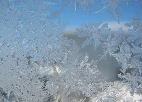 Snow pattern on winter window... Stock Photos