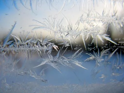 Snow pattern on winter window Stock Photos