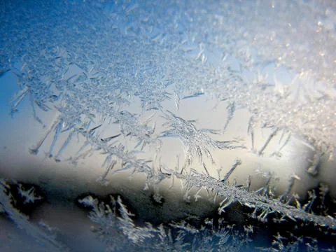 Snow pattern on winter window Stock Photos