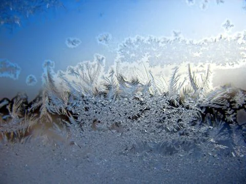 Snow pattern on winter window Stock Photos