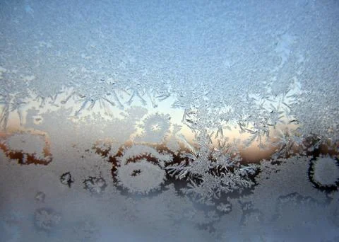 Snow pattern on winter window Stock Photos