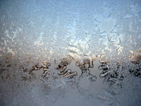 Snow pattern on winter window Stock Photos