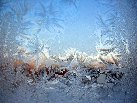 Snow pattern on winter window Stock Photos