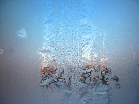 Snow pattern on winter window Stock Photos