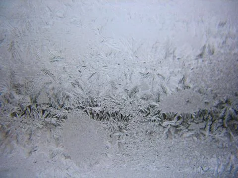 Snow pattern on winter window Stock Photos