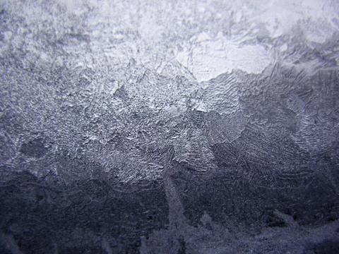 Snow pattern on winter window Stock Photos