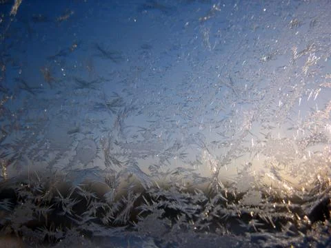 Snow pattern on winter window Stock Photos