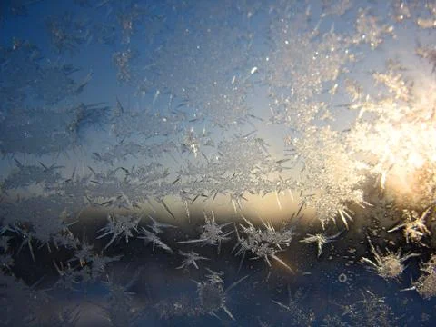 Snow pattern on winter window Stock Photos