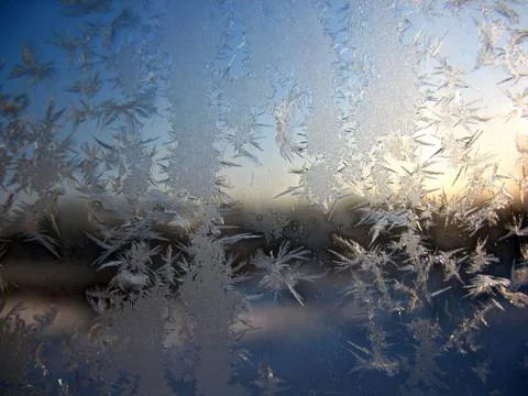 Snow pattern on winter window Stock Photos