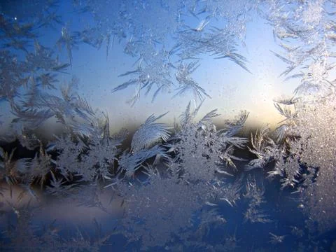 Snow pattern on winter window Stock Photos