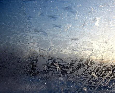 Snow pattern on winter window Stock Photos