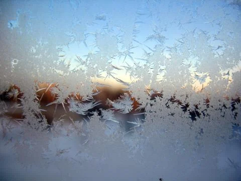 Snow pattern on winter window Stock Photos