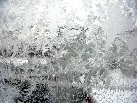 Snow pattern on winter window Stock Photos