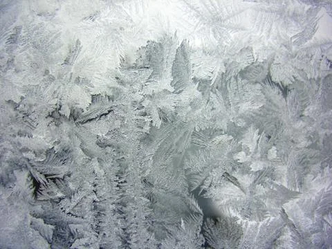 Snow pattern on winter window Stock Photos
