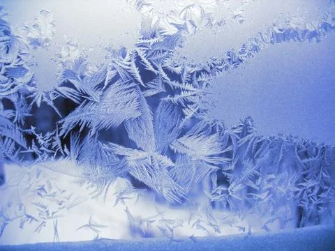 Snow pattern on winter window Stock Photos