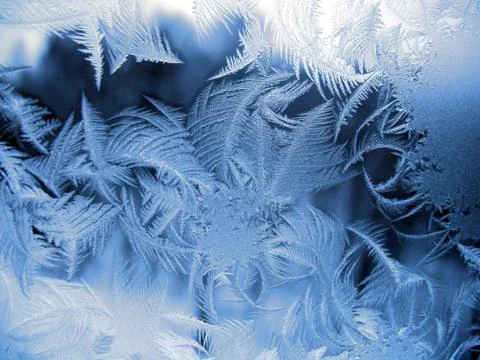 Snow pattern on winter window Stock Photos