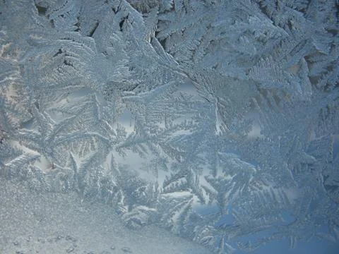 Snow pattern on winter window... Stock Photos