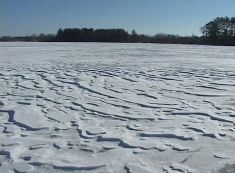 Snow patterns and textures on frozen lake, abstract natural backgrounds Stock Footage 295816969