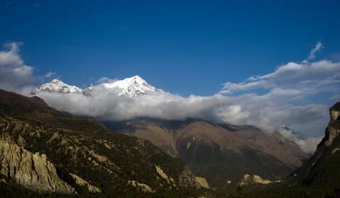 Snow peak mountain in cloud Stock Photos