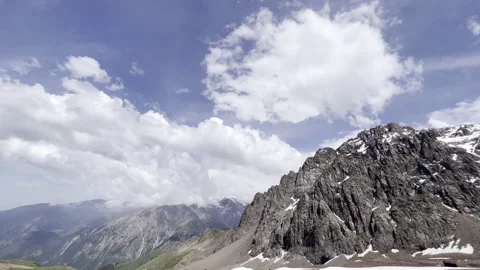 Snow peaks. Clouds in the mountains. High rocks. Stock Footage 200128589