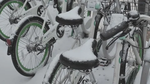 Snow piled up on a parked bicycle Stock Footage 85322118