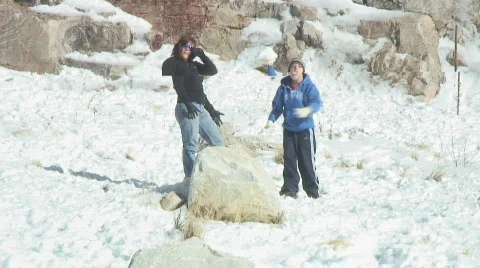 Snow Play - 3 - kid throws clump of snow. Stock Footage 303568