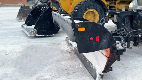 Snow Plow Attachment on Heavy Loader Stock Photos