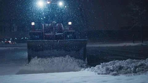 Snow plow bucket wheel loader machine move snowfall winter night Stock Footage 144686442