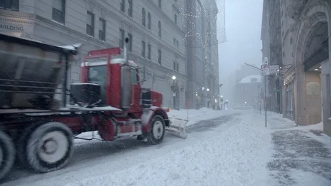 Snow plow passing and pushing snow off the road in boston. Stock Footage 112164569