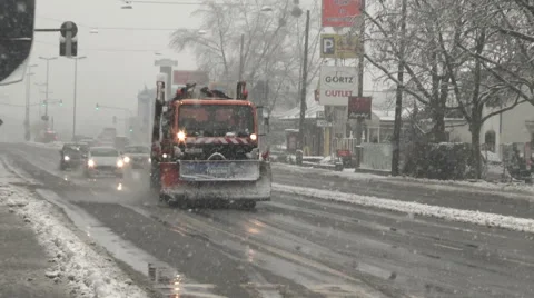 Snow plow on street Stockbeeldmateriaal 45603456