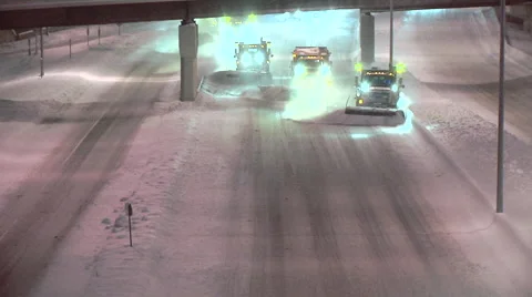 Snow Plow Trucks Plowing Interstate - V3 Stock Footage 42764320