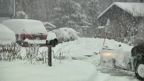 Snow plowing driveway in suburbs Video stock 72381219