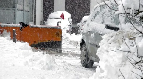 Snow plowing with tractor under heavy snowing Stock Footage 46385820