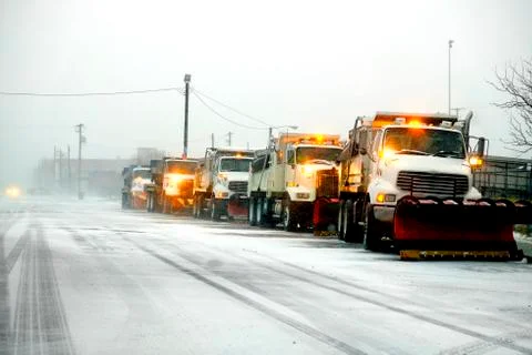 Snow Plows in Severe Blizzard Preparing for Storm Stock Photos