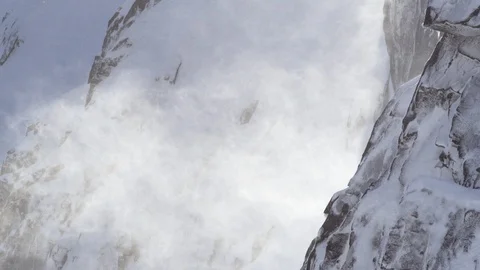 Snow powder blowing with the wind on snow covered mountains Stock Footage 113228197