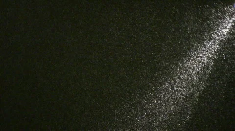 Snow in ray of light. Night. Stock Footage 313041