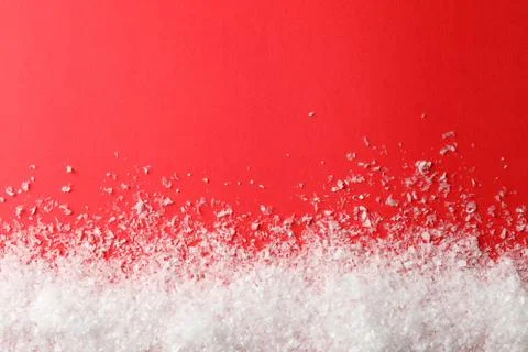 Snow on red background, space for text Stock Photos